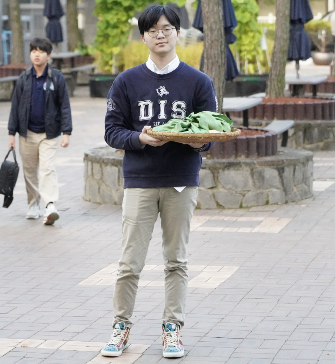 Junior Jerome Kwon packs all his school materials into a fruit basket, carefully wrapped in a swaddle to keep everything secure and prevent anything from spilling out.